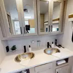 Double sink vanity in bathroom May Show Optional Features. Features and Options Subject to Change Without Notice.