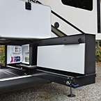 This party slide is only 20” wide, and tucks nicely into most
fifth wheel front storage compartments. It packs a whopping
punch with a 50” hidden TV on a double lift, a fold-up
countertop with hidden storage, 110V mini refrigerator,
and a Suburban gas griddle on a steel slide out tray. May Show Optional Features. Features and Options Subject to Change Without Notice.