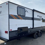 Back entry side exterior view of the 282QBXL with the power awning and outside kitchen closed. May Show Optional Features. Features and Options Subject to Change Without Notice.