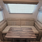 Rear Lounge with Table May Show Optional Features. Features and Options Subject to Change Without Notice.