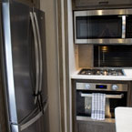  	Kitchen refrigerator, oven, and microwave May Show Optional Features. Features and Options Subject to Change Without Notice.