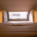 Front bedroom with wardrobes on each site of the bed and a front window. May Show Optional Features. Features and Options Subject to Change Without Notice.