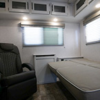 Rear wall showing recliner and sofa converted into a bed. May Show Optional Features. Features and Options Subject to Change Without Notice.