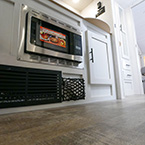 Kitchen flooring showing microwave May Show Optional Features. Features and Options Subject to Change Without Notice.