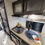Kitchen and view of bathroom May Show Optional Features. Features and Options Subject to Change Without Notice.