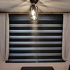 Deluxe zebra day/night shades in the main living area May Show Optional Features. Features and Options Subject to Change Without Notice.