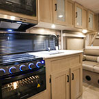 Kitchen with microwave and storage May Show Optional Features. Features and Options Subject to Change Without Notice.