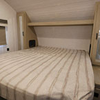 Bed with mirrored wardrobes on either side May Show Optional Features. Features and Options Subject to Change Without Notice.