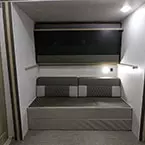 Off-Door Side Slideout in Bunkhouse with Top 30x74 Bunk Flipped Up May Show Optional Features. Features and Options Subject to Change Without Notice.