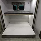 Off-Door Side Slideout in Bunkhouse with Top Bunk and Versa-Queen in Sleeping Position May Show Optional Features. Features and Options Subject to Change Without Notice.