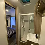 Bathroom sink with mirrored medicine cabinet, shower with sliding glass door and ceiling vent fan May Show Optional Features. Features and Options Subject to Change Without Notice.