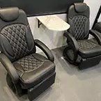 Two Euro recliners with thermofoil shelf in-between May Show Optional Features. Features and Options Subject to Change Without Notice.