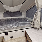 One end of camper with bed May Show Optional Features. Features and Options Subject to Change Without Notice.