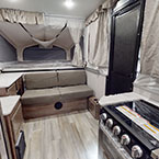 View of entry, cooktop, seating, and bed May Show Optional Features. Features and Options Subject to Change Without Notice.