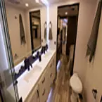 Bathroom with double sink vanity and toilet May Show Optional Features. Features and Options Subject to Change Without Notice.