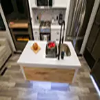 Overhead view of kitchen island with flip up counter top shown down May Show Optional Features. Features and Options Subject to Change Without Notice.