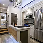 Stainless steel fridge and kitchen island May Show Optional Features. Features and Options Subject to Change Without Notice.