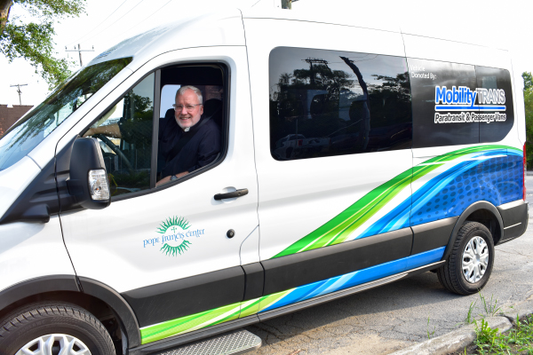 Dave Brown, General Manager of MobilityTRANS, driving a Ford E-Transit.